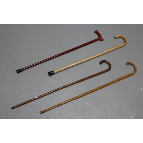 674 - Four Vintage Walking Sticks