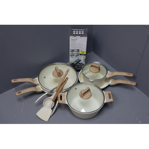 900 - A Carote White Granite Eleven Piece Pan Set, With Boxed Vegetable Chopper