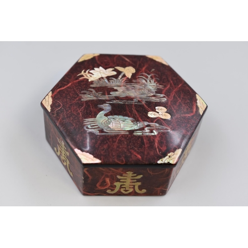52 - Oriental hexagonal Lacquered box inlaid with Mother of Pearl containing a Selection of Jewellery