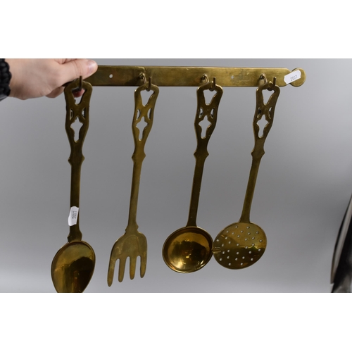 293 - Four Large Brass Utensils with Brass Hanger