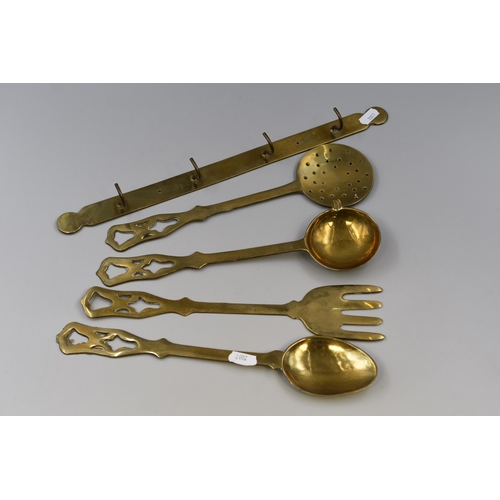 293 - Four Large Brass Utensils with Brass Hanger