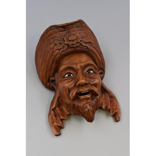 208 - A Carved Wooden Chinese Mask With Inlaid Bone Eyes and Teeth, Approx 7” Tall