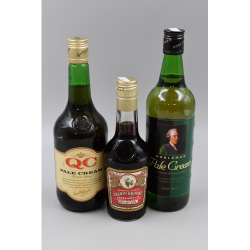 313 - Two Sealed Bottles of Sherry, With Sealed Bottle of Cherry Brandy.