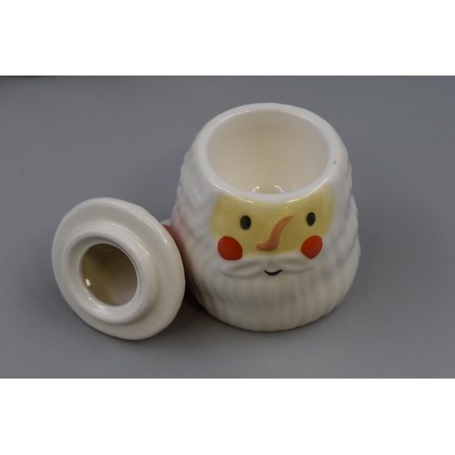 216 - Four Father Christmas Lidded Condiment Pots