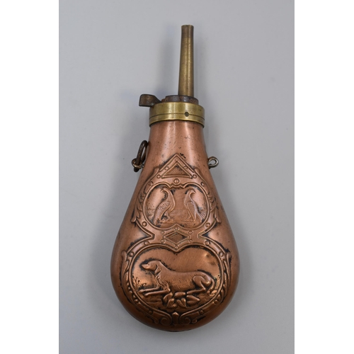 221 - A Copper and Brass Gunpowder Flask, With Embossed Hunting Scene. Approx 7.5” Long