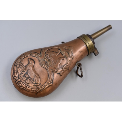 221 - A Copper and Brass Gunpowder Flask, With Embossed Hunting Scene. Approx 7.5” Long