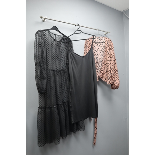 597 - Large Selection of Ladies Clothing in Various Sizes (Approx. 16 items). With Coat Hangers