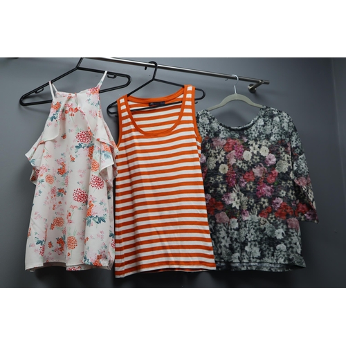 597 - Large Selection of Ladies Clothing in Various Sizes (Approx. 16 items). With Coat Hangers