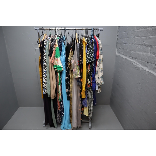 599 - Large Selection of Ladies Clothing in Various Sizes. Clothing Rail Included