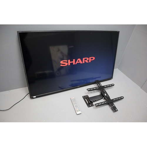 485 - Sharp 50 Inch Smart TV With Remote and Wall Bracket. Fully Working