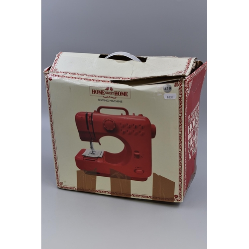 545 - Lightweight Red Home from Home Sewing Machine complete with power cord and pedal powers on when test... 