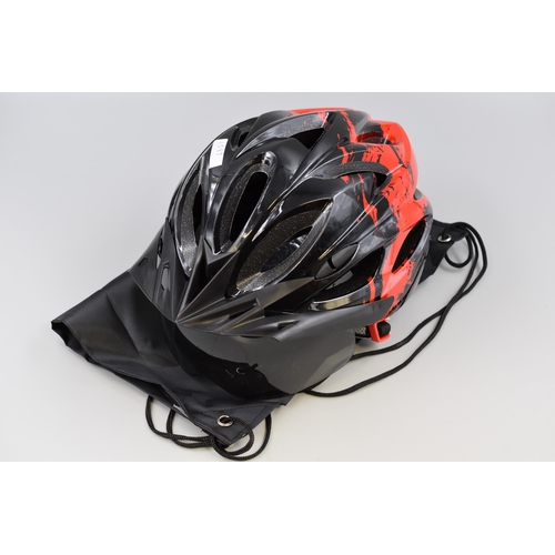 711 - Brand new Cycling helmet in red and black with visor and rechargeable rear light (includes charging ... 