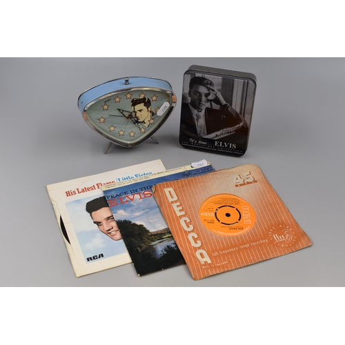 564 - Elvis Mixed Lot to include Three Vinyl Singles, Pocket Watch in Tin and a Desk clock (a/f)