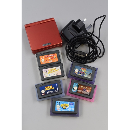 464 - A Nintendo Gameboy Advance SP (Red), With A Selection of Games and Charger. Includes Tetris, Crash B... 