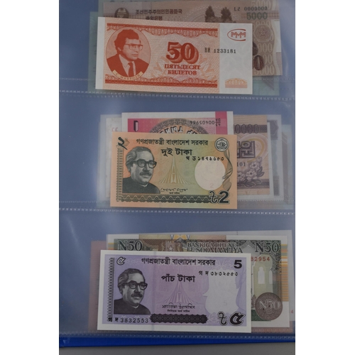 194 - Folder Containing a Large Selection of Uncirculated Worldwide Banknotes. Includes Zambia, Syria, Ban... 