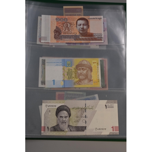 197 - Folder Containing a Large Selection of Uncirculated Worldwide Banknotes. Includes Cambodia, Ukraine,... 