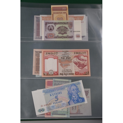 197 - Folder Containing a Large Selection of Uncirculated Worldwide Banknotes. Includes Cambodia, Ukraine,... 