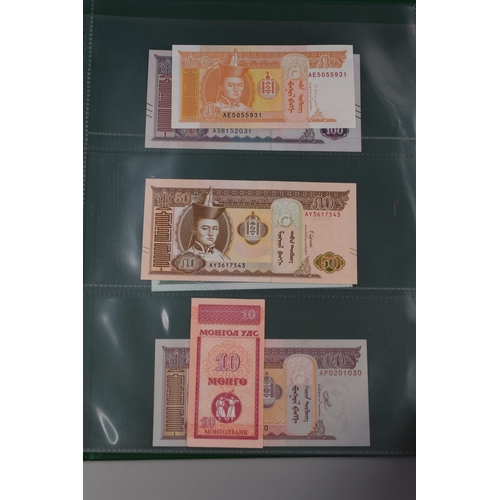 197 - Folder Containing a Large Selection of Uncirculated Worldwide Banknotes. Includes Cambodia, Ukraine,... 