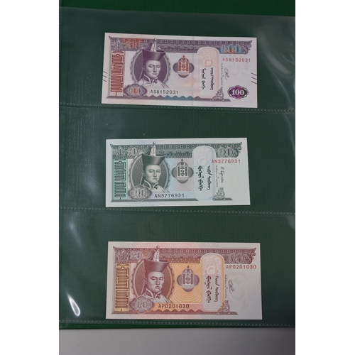 197 - Folder Containing a Large Selection of Uncirculated Worldwide Banknotes. Includes Cambodia, Ukraine,... 