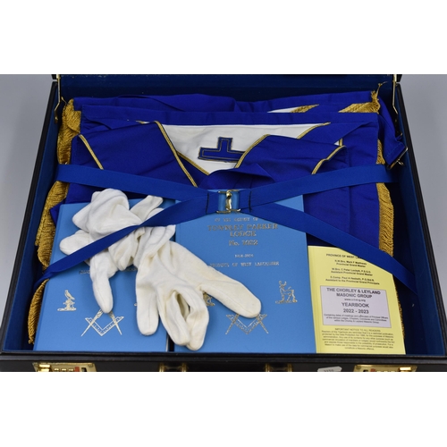 633 - Briefcase containing a selection of Masonic Regalia including Aprons, Sashes, Books and More