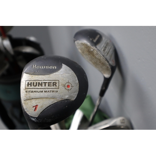 712 - Two Golf Bags Containing a Selection of Clubs by Pinseeker and Hunter