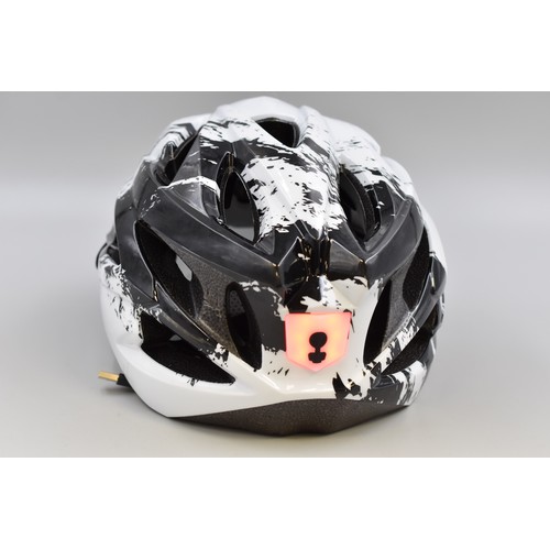 765 - Brand new Cycling helmet in black and white with visor and rechargeable rear light (includes chargin... 