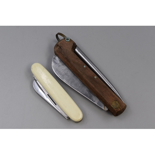 244 - Two Vintage Pocket Knives to include a Rodgers Spike Knife and a Outdoor Utility Pocket Knife