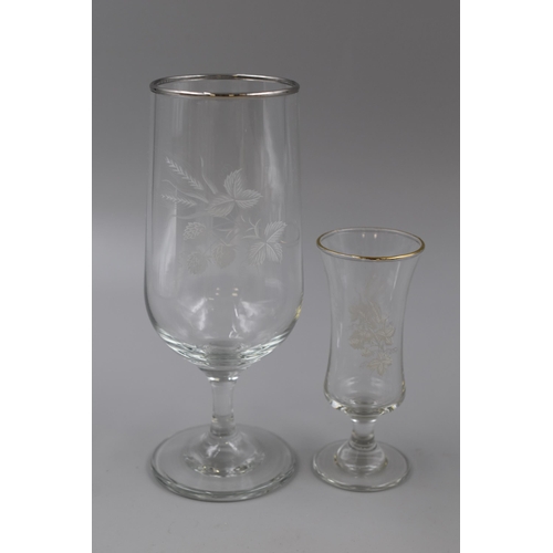 813 - A Set of Twelve Etched Strawberry Design Drinking Glasses, In Two Sizes