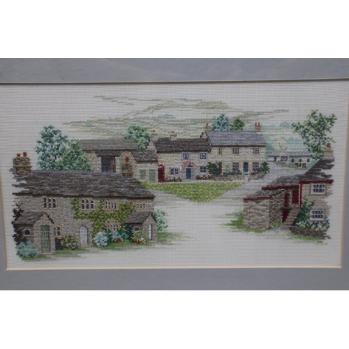 830 - Three Framed and Glazed Embroidery Art Pieces To Include Two Landscapes and Floral. Largest Approx 1... 