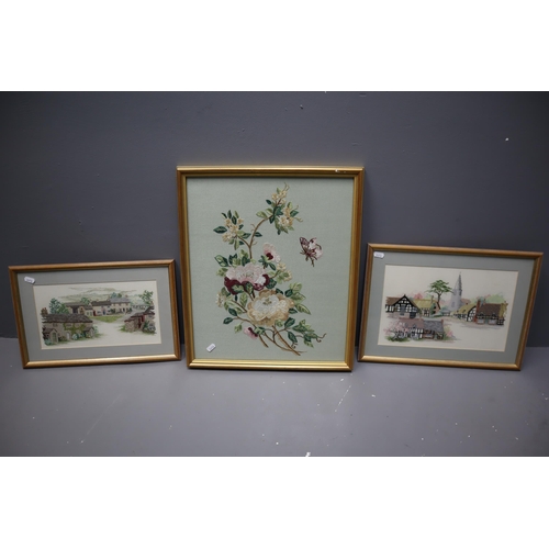 830 - Three Framed and Glazed Embroidery Art Pieces To Include Two Landscapes and Floral. Largest Approx 1... 