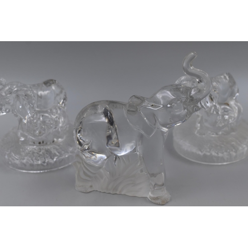 285 - Four Elephant Crystal Figures. Includes Three Matching RCR Figures, and Lenox Elephant Paperweight