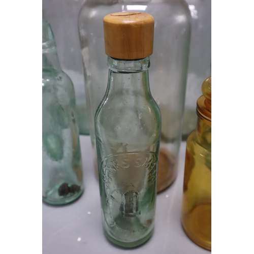 847 - Selection of Vintage Glass Bottles. Includes a Poison Bottle, Associates Dairies, WM Moore, James Sm... 