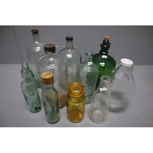 847 - Selection of Vintage Glass Bottles. Includes a Poison Bottle, Associates Dairies, WM Moore, James Sm... 