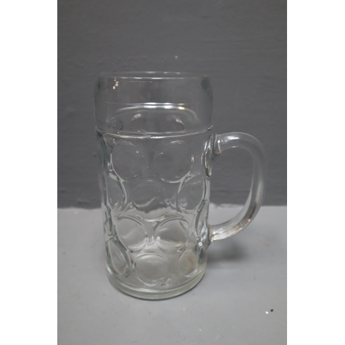 888 - A Selection of 32 Artis Glass 45oz Beer Steins