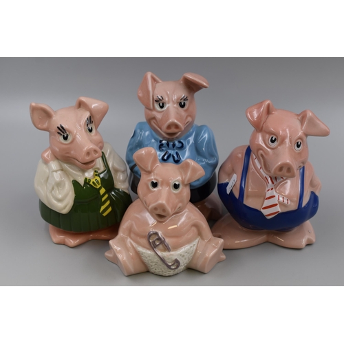 725 - A Set of Four Ceramic Wade Nat West Piggy Banks