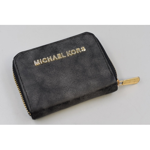 110 - A Black Leather Michael Kors Purse