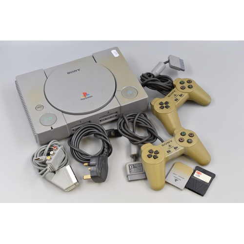 568 - Sony Playstation with 2 Controllers and Cables (Powers on)