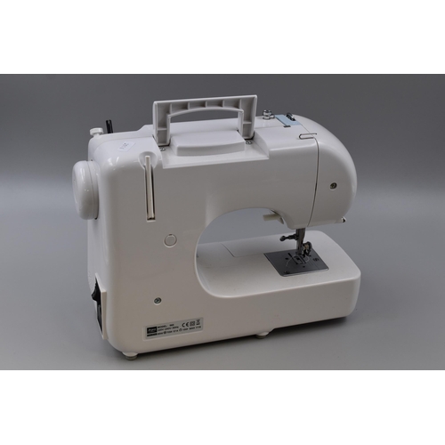 791 - Lightweight Argos 565 Sewing Machine Complete with power/Pedal Lead and Dust Cover powers on when te... 