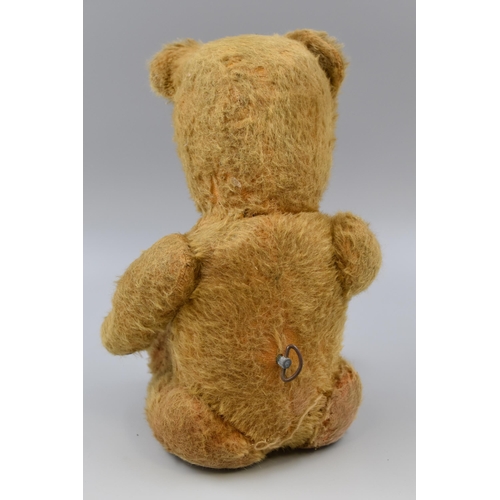 255 - 1940's teddy bear with fully jointed limbs, musical and plays rock-a-bye baby, mechanical key wound,... 