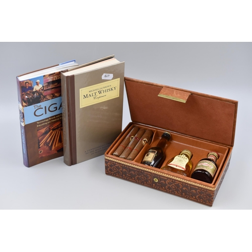 415 - A Boxed Whiskey and Cigar Set, With Two Books on Whisky and Cigars. Includes Three Sealed Whiskey Mi... 