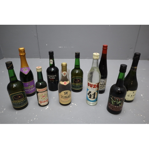 261 - Selection of 10 Sealed Bottles including Ouzo, Norfolk Punch, Vintage Cava, Cockburn's port and More