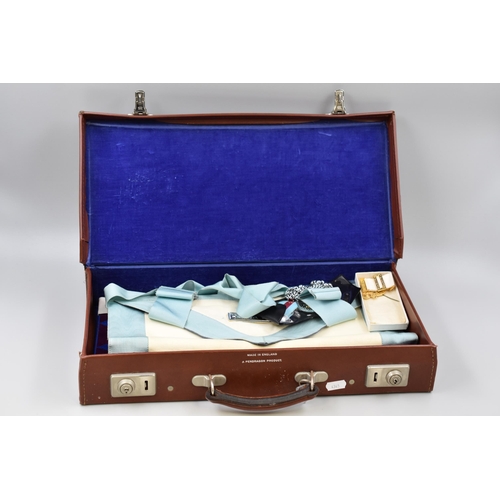 308 - A Briefcase Containing Various Pieces of Masonic Regalia. Two Aprons and Two Medals