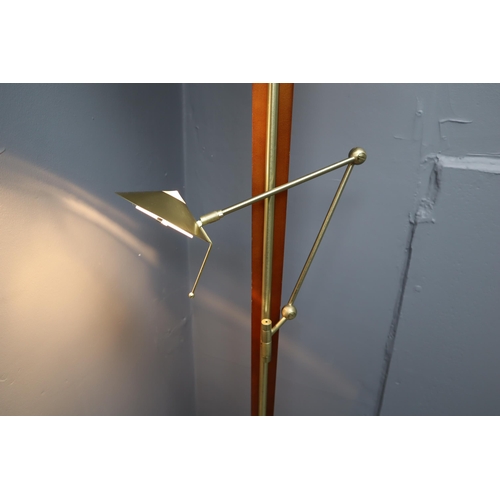 558 - A Brushed Metal and Wood Reading Floor Lamp, With Rotating Glass Table and Adjustable Lights. Powers... 