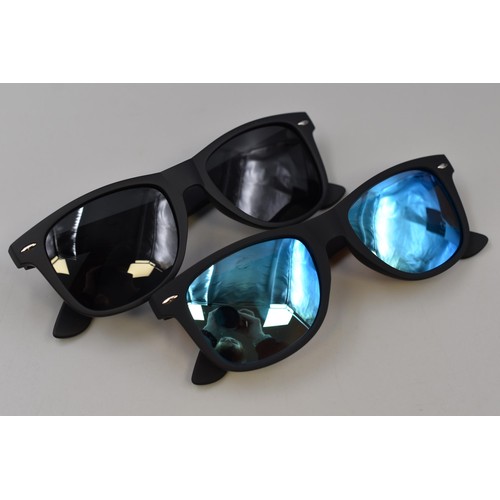 352 - Four pairs (2 per box) of mens polarized sun glasses with blue and black lenses, brand new and boxed