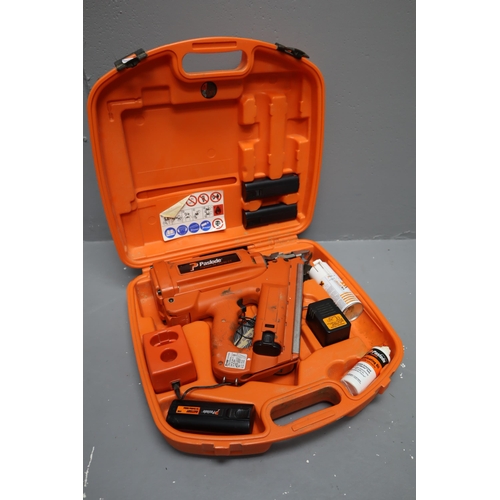 579 - A Paslode Impulse IM 350/90 CT Nail Gun. Comes With Four Batteries, Cleaning Fluid, Lubricant, and A... 