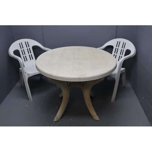 594 - White Plastic Circular Garden Table with Two Matching Chairs (table legs do remove for transportatio... 