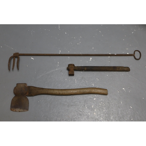 597 - A Selection of Tools To Include Blacksmiths Hammer, Brades Axe, And Fire Clinker Tool