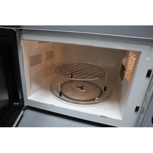 511 - Sharp R744 Microwave Oven powers on when tested complete with Instruction manual