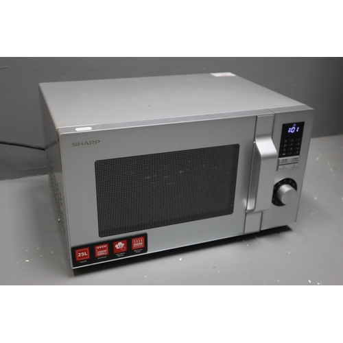 511 - Sharp R744 Microwave Oven powers on when tested complete with Instruction manual