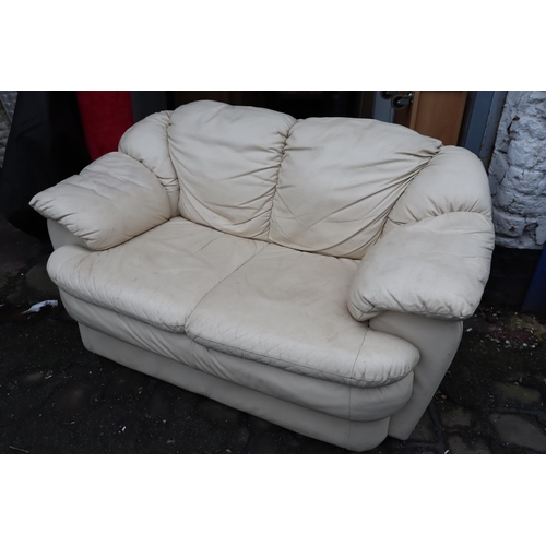 Cream Leather 2 Seater Sofa (61” x 37” x 32”)
